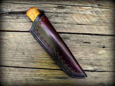 primitive knife with a tooled leather sheath