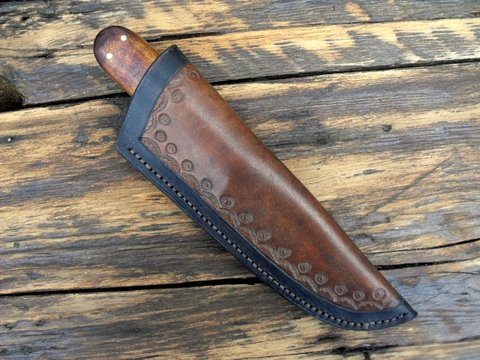 hand made custom knife with a leather sheath