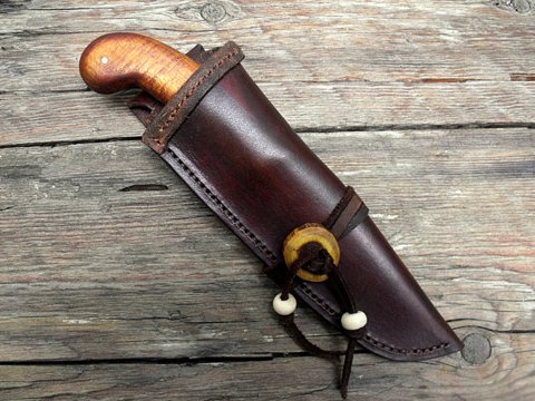 period knife with a decorated leather sheath