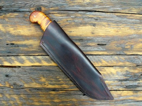 Bowie knife with a leather sheath